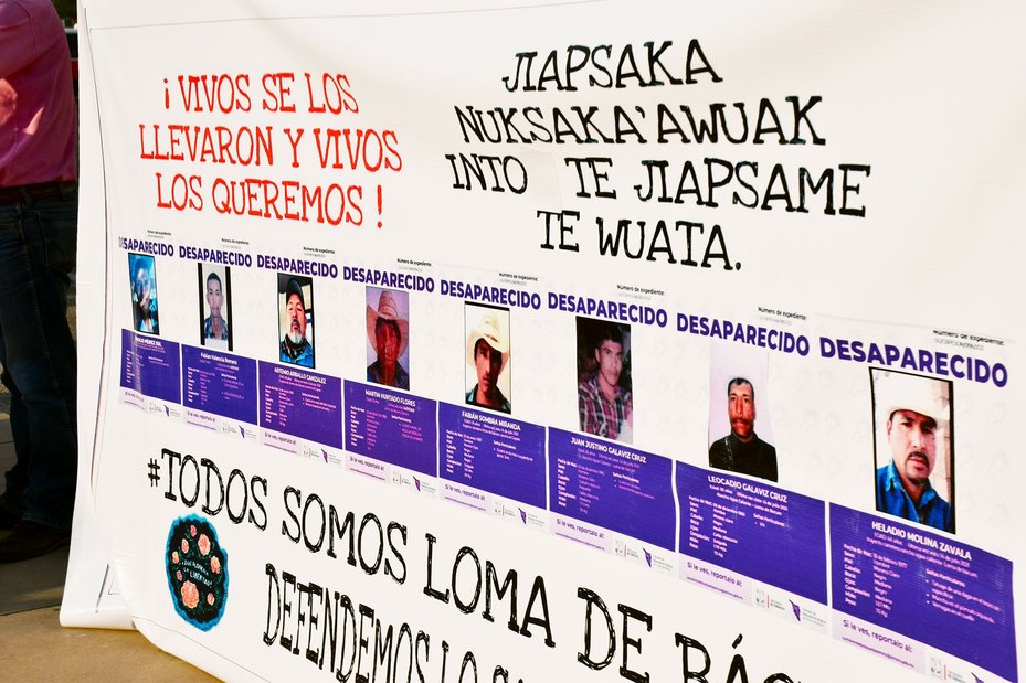 Banner showing the photos of the missing Yaqui Indigenous community in Sonora, Mexico