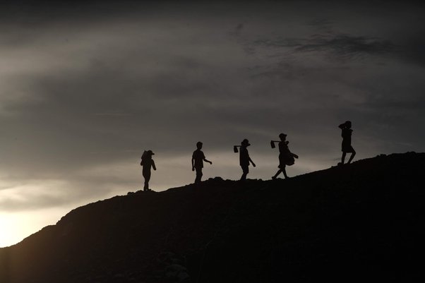 Soldiers walking through field