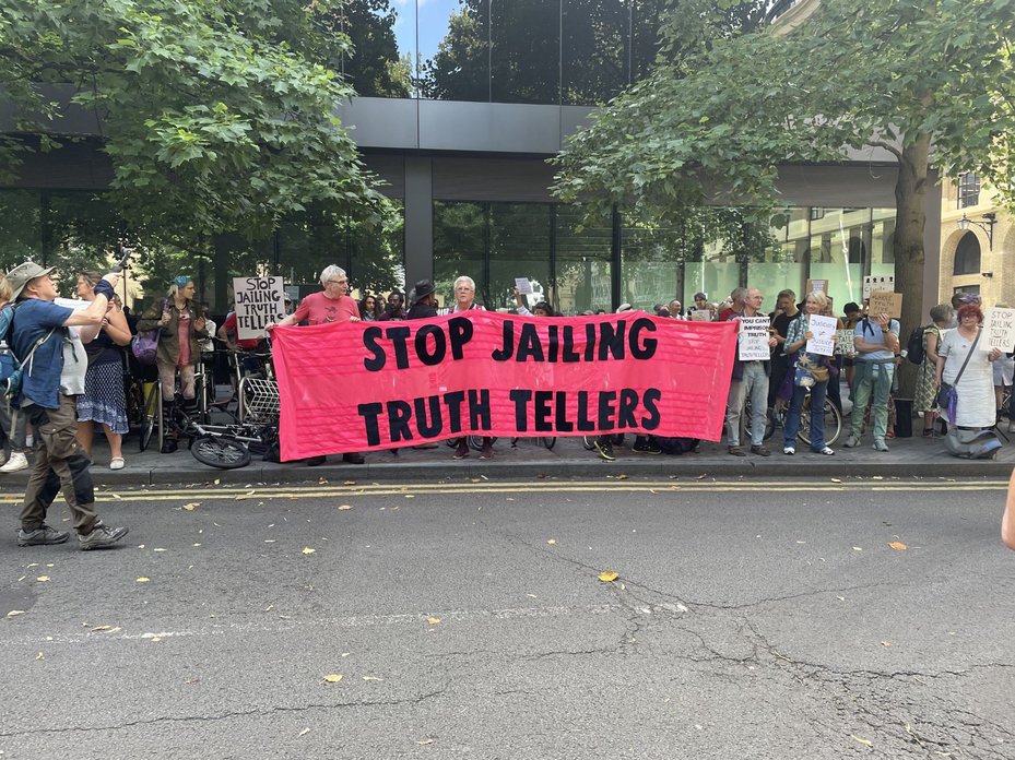 demonstrators assemble outside Southwark Crown Court in London