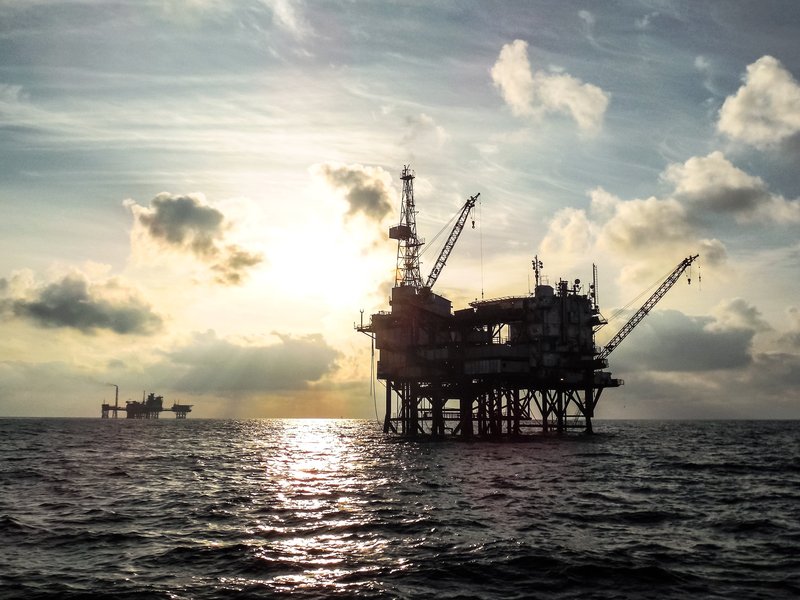 Offshore oil platform at sunset