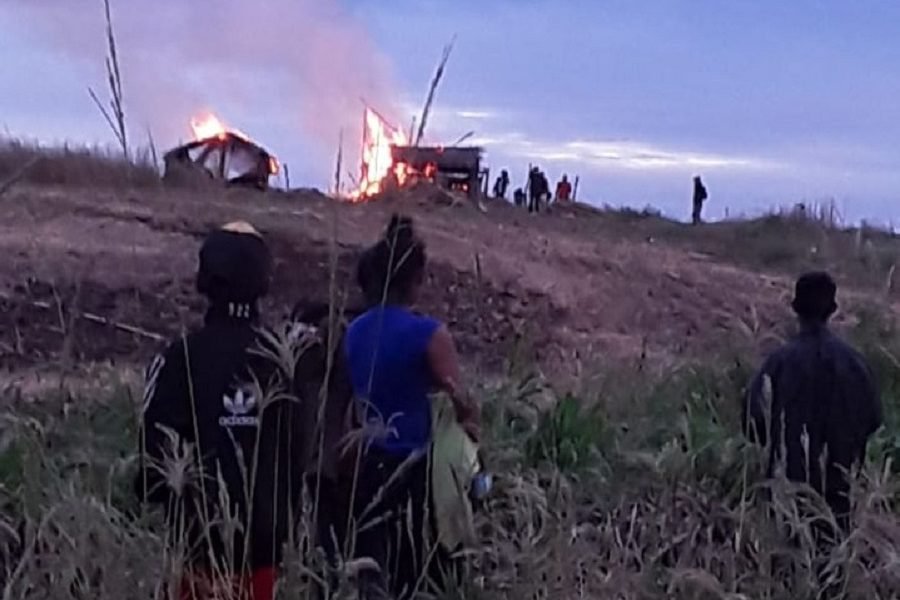 Homes of the Mbya Guaraní community at Loma Piro'y in Paraguay being burned down